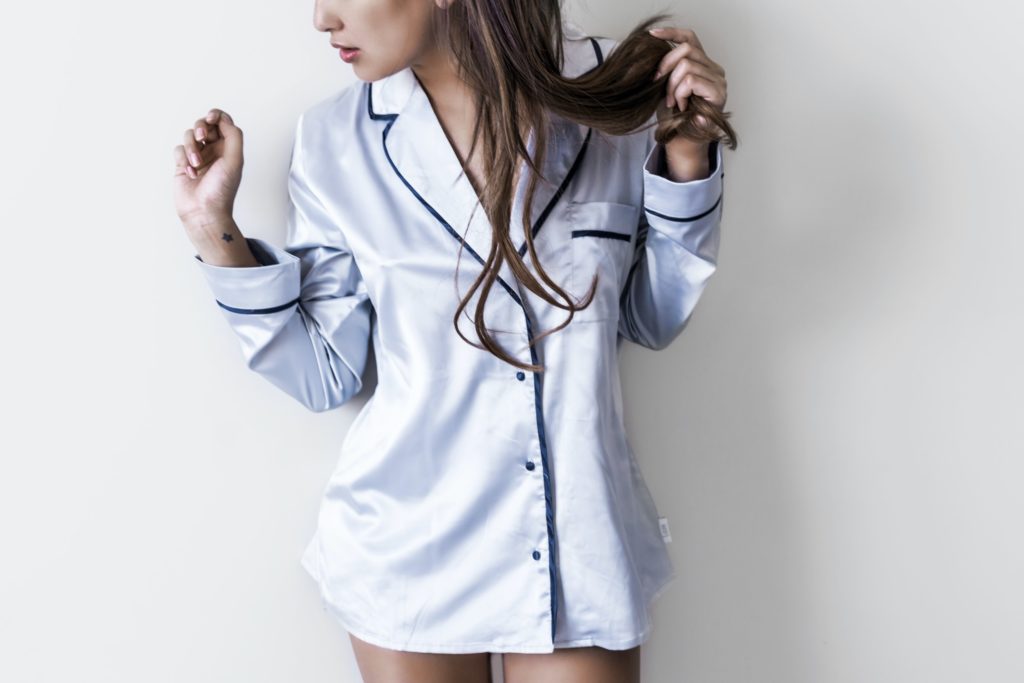 photo of a woman wearing grey silk pajamas from unsplash