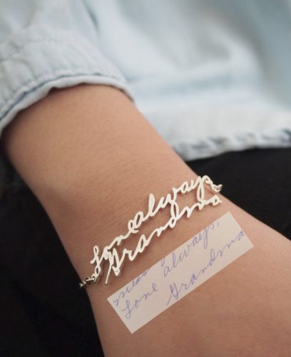 Custom handwriting bracelet in yellow gold that reads 